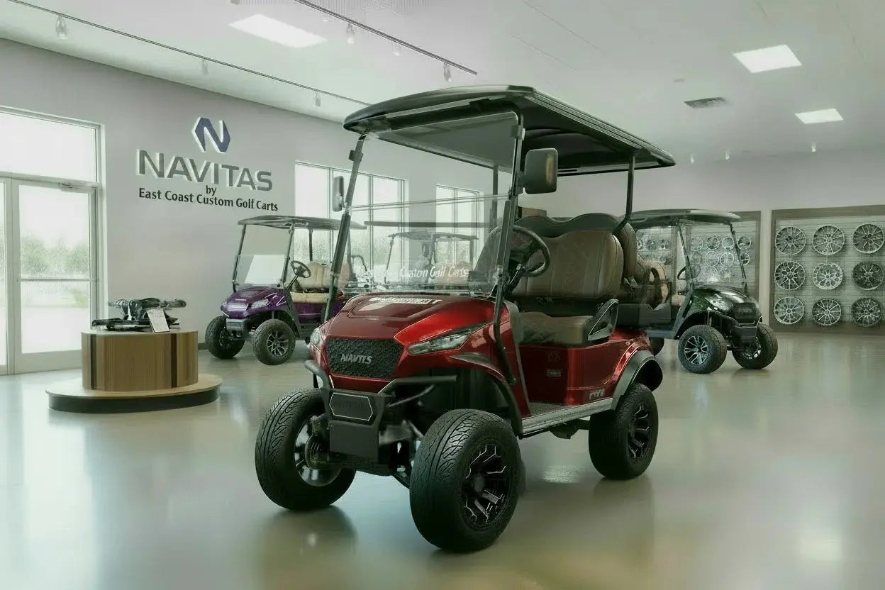 Navitas Lifted Aluminum Chassis Cherry Metallic with mocha brown seats,  driver front angle view in EC showroom