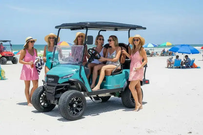 Navitas Chassis Sea Storm with Rust Brown seat at the beach with people