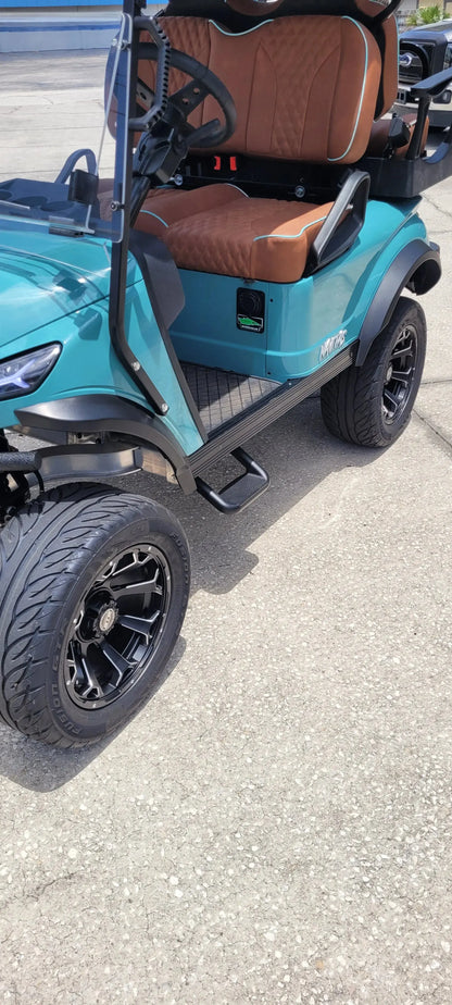 Navitas Lifted Aluminum Chassis Seat Storm with rust seats,  foot step view in EC lot.