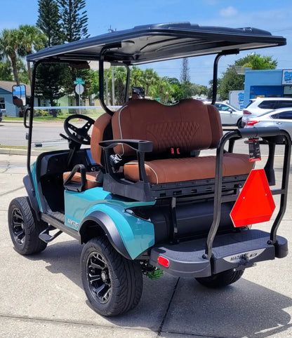 Navitas Lifted Aluminum Chassis Seat Storm with rust seats,  driver rear seat angle view in EC lot.