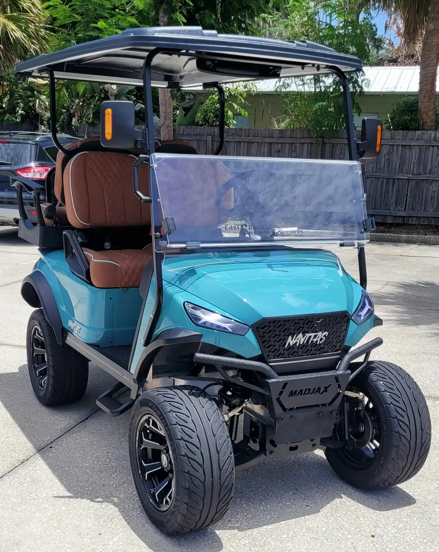 Navitas Lifted Aluminum Chassis Seat Storm with rust seats,  passenger front angle view in EC lot.