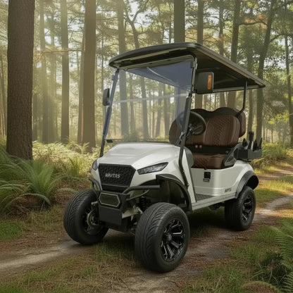 Navitas Lifted Aluminum Chassis Frost White Metallic with brown seats,  driver front angle view on a trail
