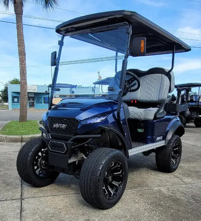 Navitas Lifted Aluminum Chassis Admiral Blue with grey seats drivers front angle view in EC lot