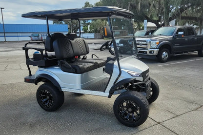 Navitas Lifted Aluminum Chassis Frost White Metallic with black seats passenger side view