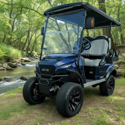 Navitas Lifted Aluminum Chassis Admiral Blue with grey seats,  driver front angle view by the brook
