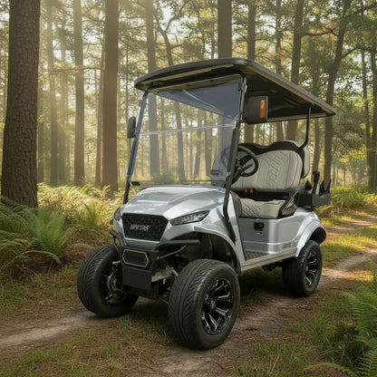 Navitas Lifted Aluminum Chassis Bright Silver with light grey seats,  driver front angle view on a trail