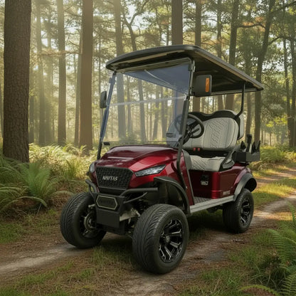Navitas Lifted Aluminum Chassis Cherry Metallic with light grey seats,  driver front angle view on a trail