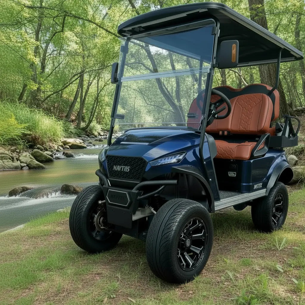 Navitas Lifted Aluminum Chassis Admiral Blue with rust brown seats,  driver front angle view by the brook